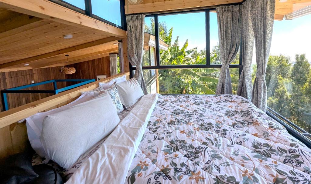 Postel nebo postele na pokoji v ubytování Cloudwalks Homestay