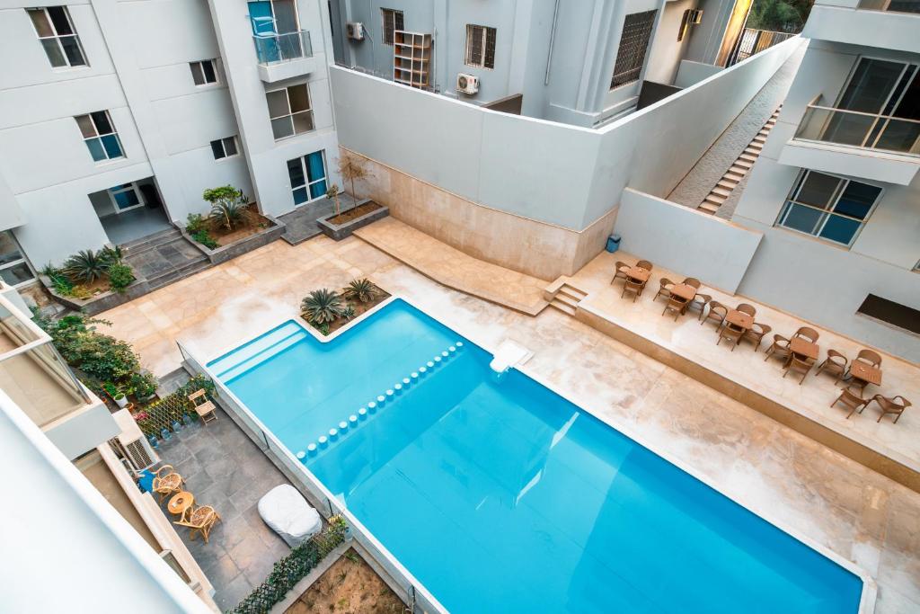 Image showcasing Peaks - Luxury 1BR Apartment Pool View R106 El Nessim, Hurghada ...