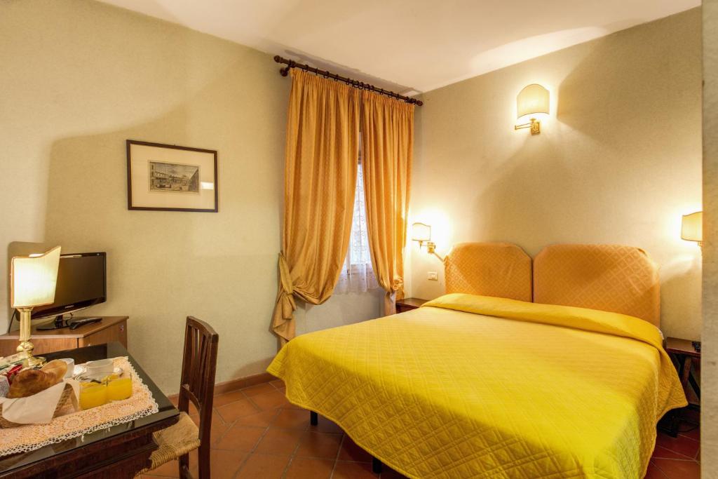 Postel nebo postele na pokoji v ubytování Hotel Rex