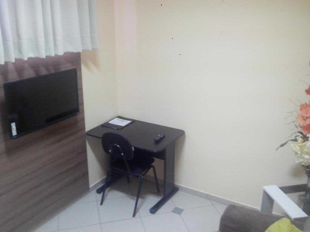 TV a/nebo společenská místnost v ubytování Estação Hotel