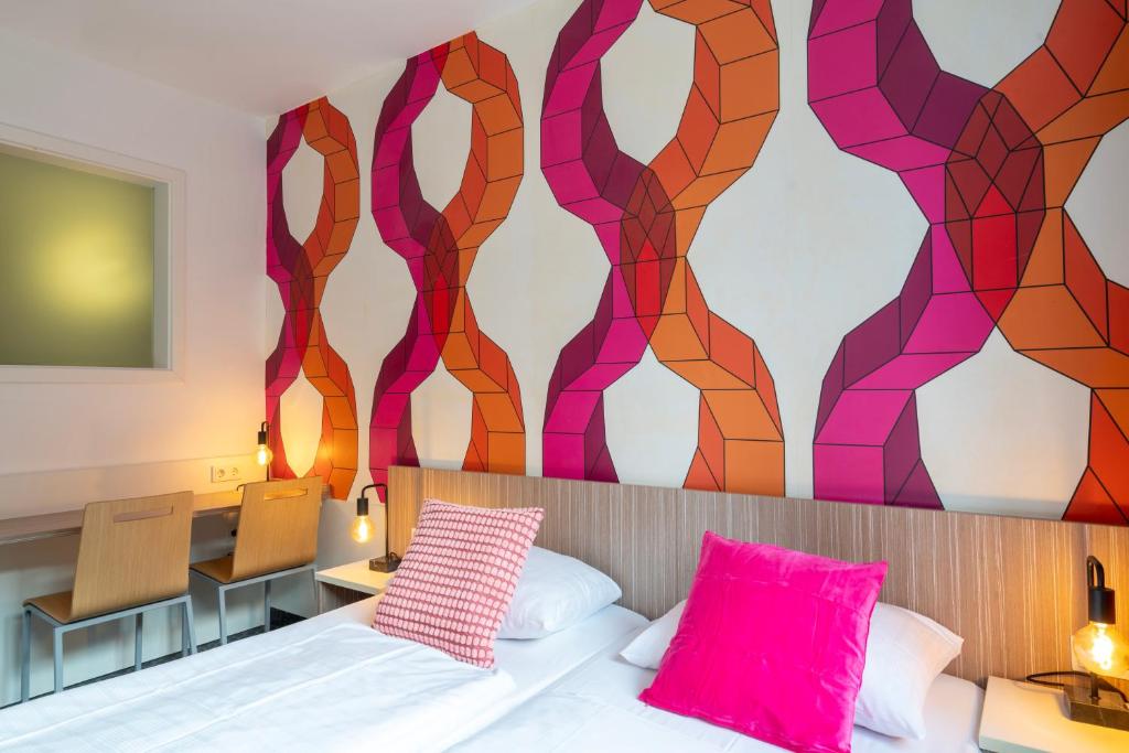 Postel nebo postele na pokoji v ubytování Hotel Madeleine Biohotel