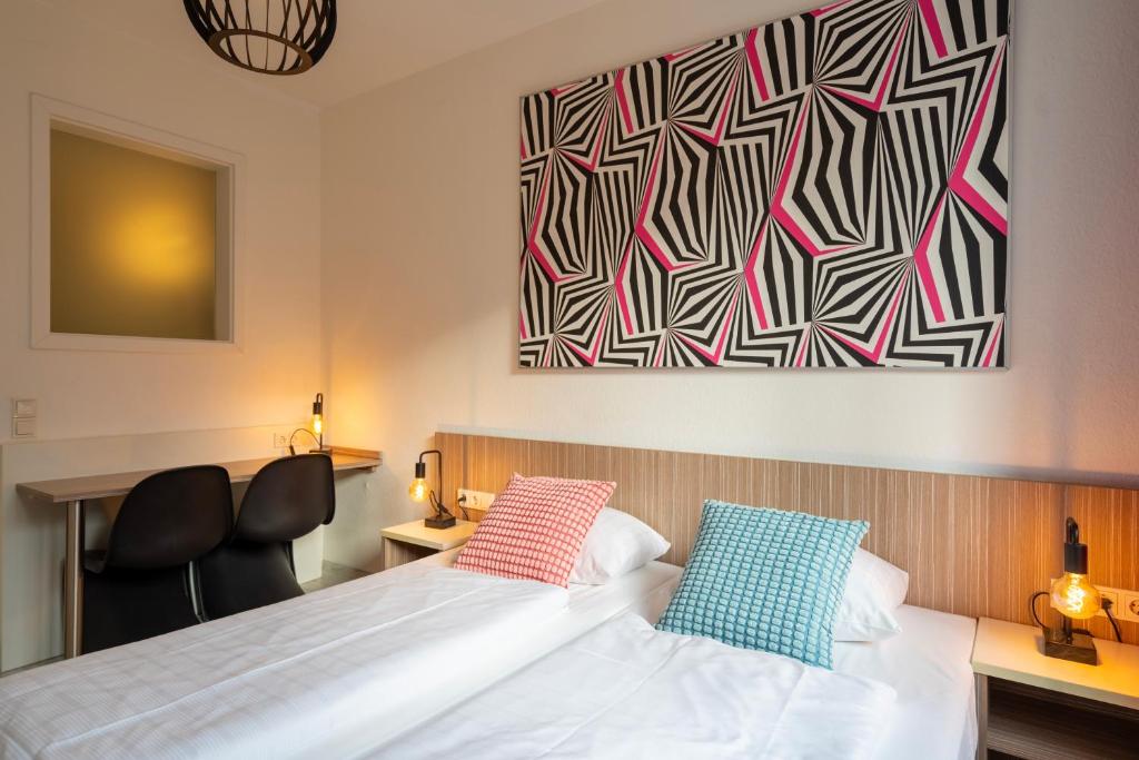 Postel nebo postele na pokoji v ubytování Hotel Madeleine Biohotel