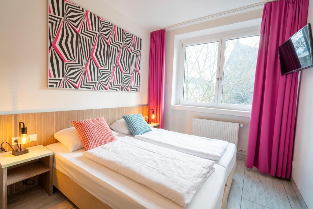Postel nebo postele na pokoji v ubytování Hotel Madeleine Biohotel