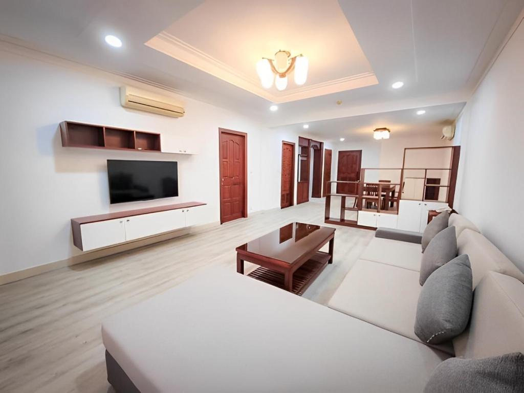 TV a/nebo společenská místnost v ubytování HAMPTONS Apartments