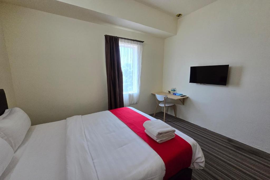 Postel nebo postele na pokoji v ubytování Hotel Seri Warisan Melaka, Stadium Hang Tuah