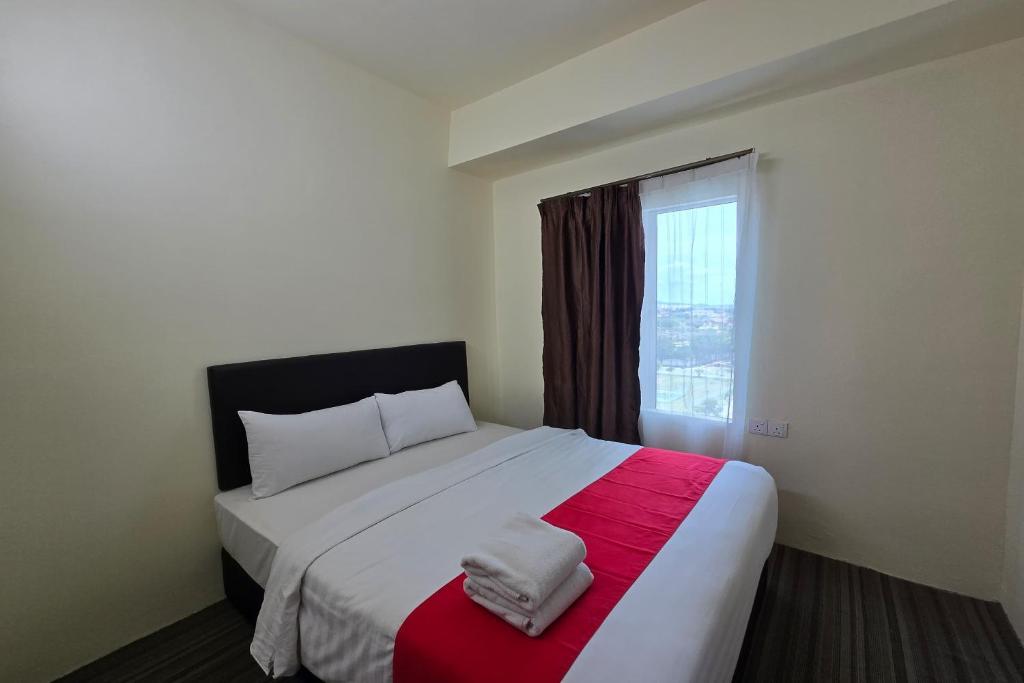 Postel nebo postele na pokoji v ubytování Hotel Seri Warisan Melaka, Stadium Hang Tuah
