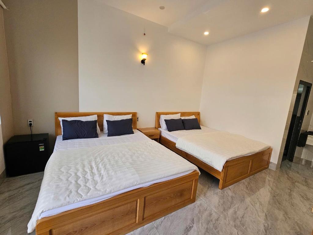 Postel nebo postele na pokoji v ubytování KHANG house