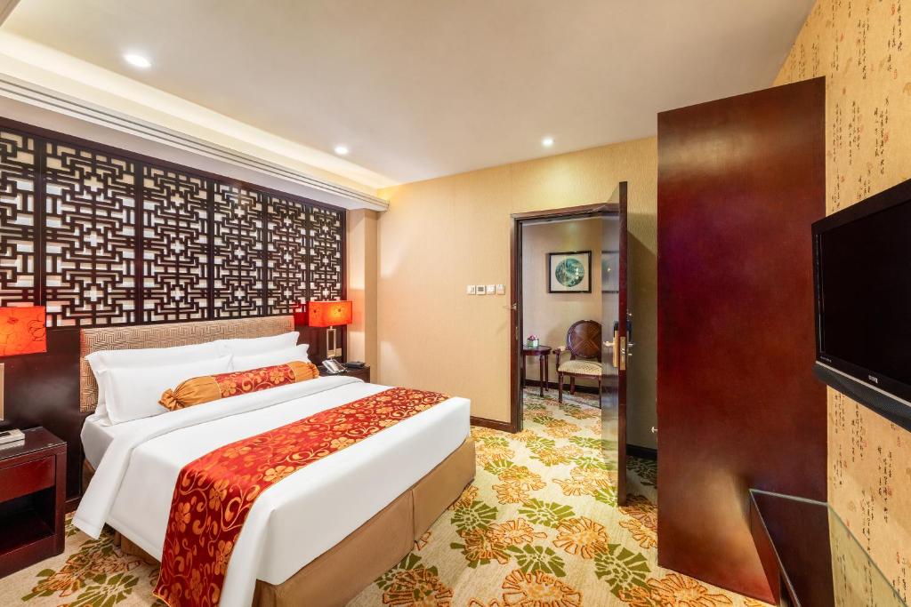 Postel nebo postele na pokoji v ubytování Hotel Metropole