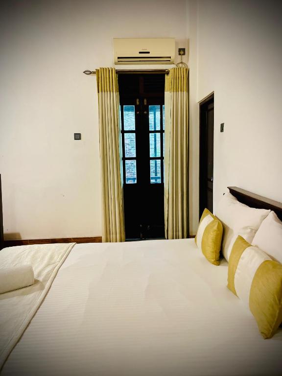 Postel nebo postele na pokoji v ubytování Hotel Grand Casa