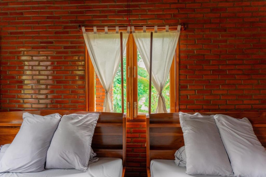 Postel nebo postele na pokoji v ubytování Homestay Dream hill