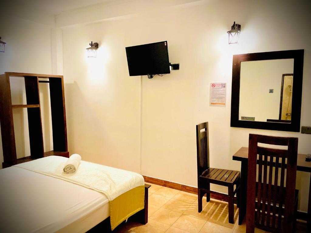 Postel nebo postele na pokoji v ubytování Hotel Grand Casa