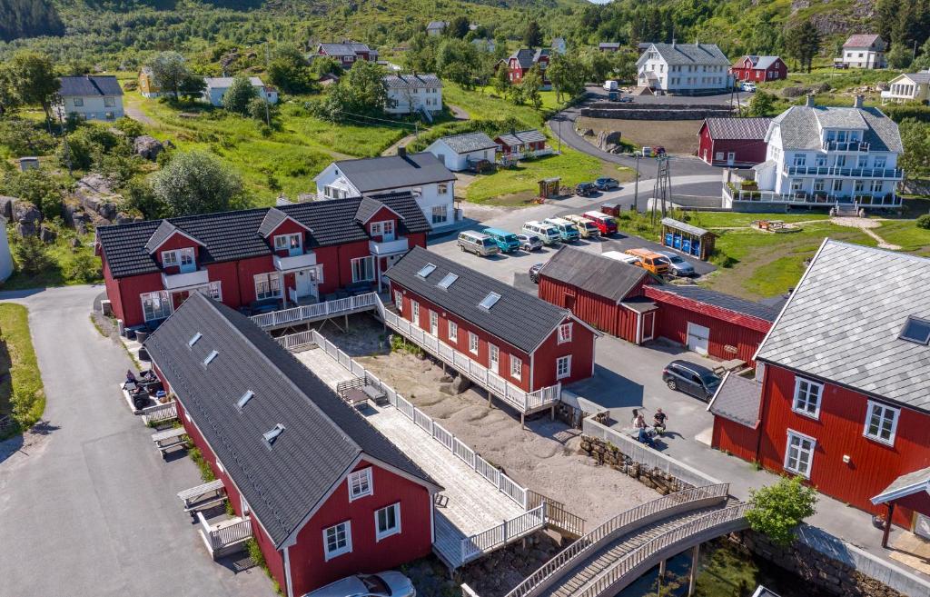 an aerial view of a small town with red buildings at Ure Lodge, Leknes, Lofoten in Sennesvik