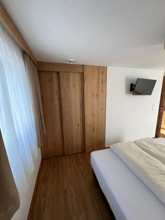 Postel nebo postele na pokoji v ubytování Berggasthof Hochzeigerhaus