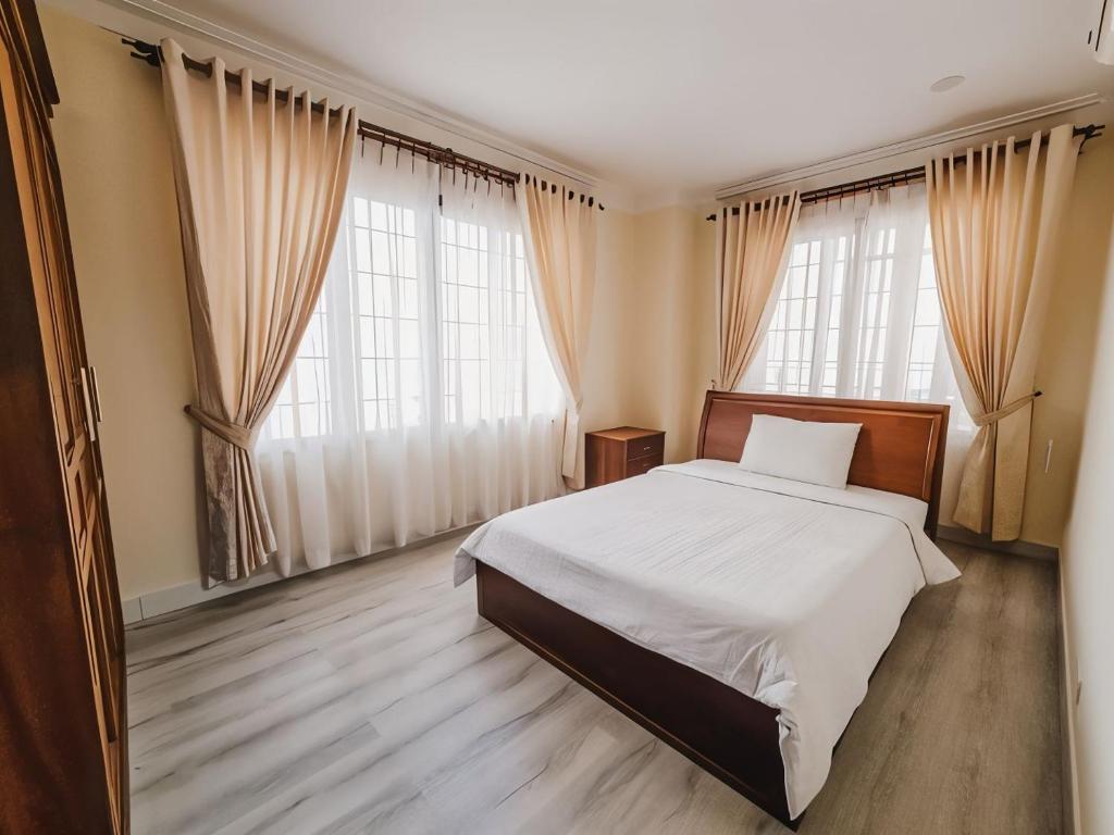 Postel nebo postele na pokoji v ubytování HAMPTONS Apartments