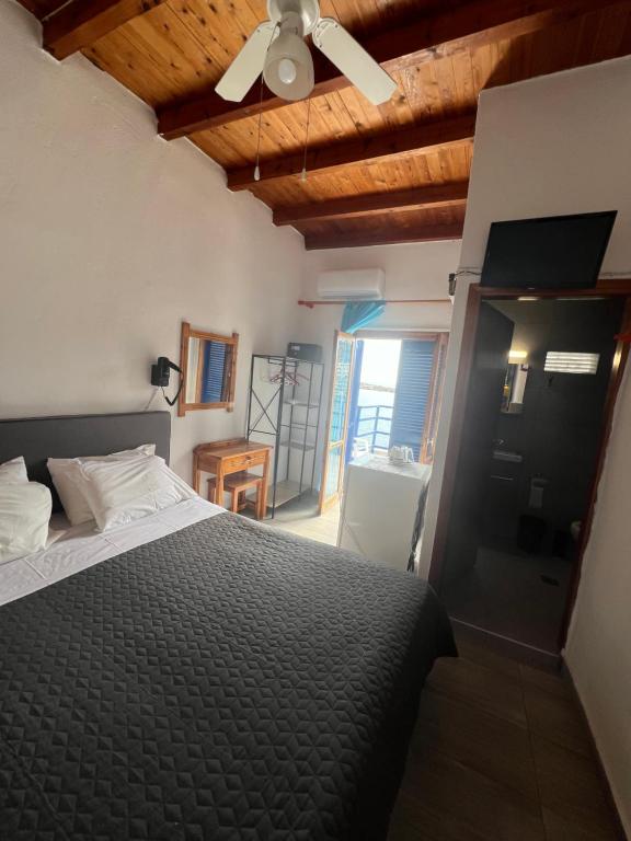 Postel nebo postele na pokoji v ubytování Scirocco Rooms