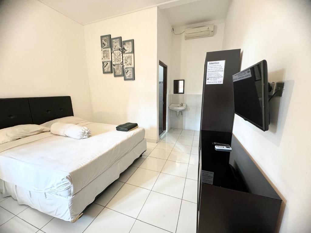 Postel nebo postele na pokoji v ubytování Paradise Inn