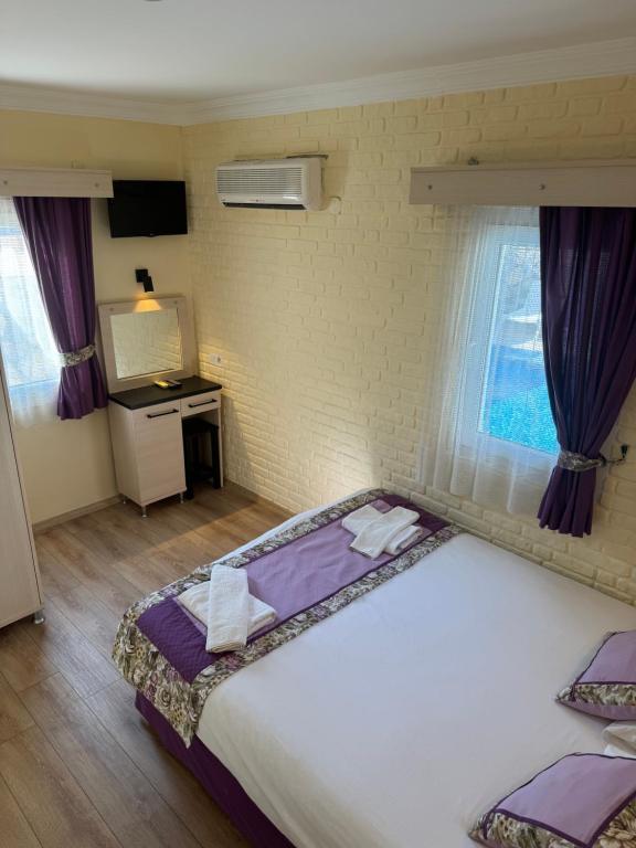 Postel nebo postele na pokoji v ubytování Canna Garden Hotel - Adult Only