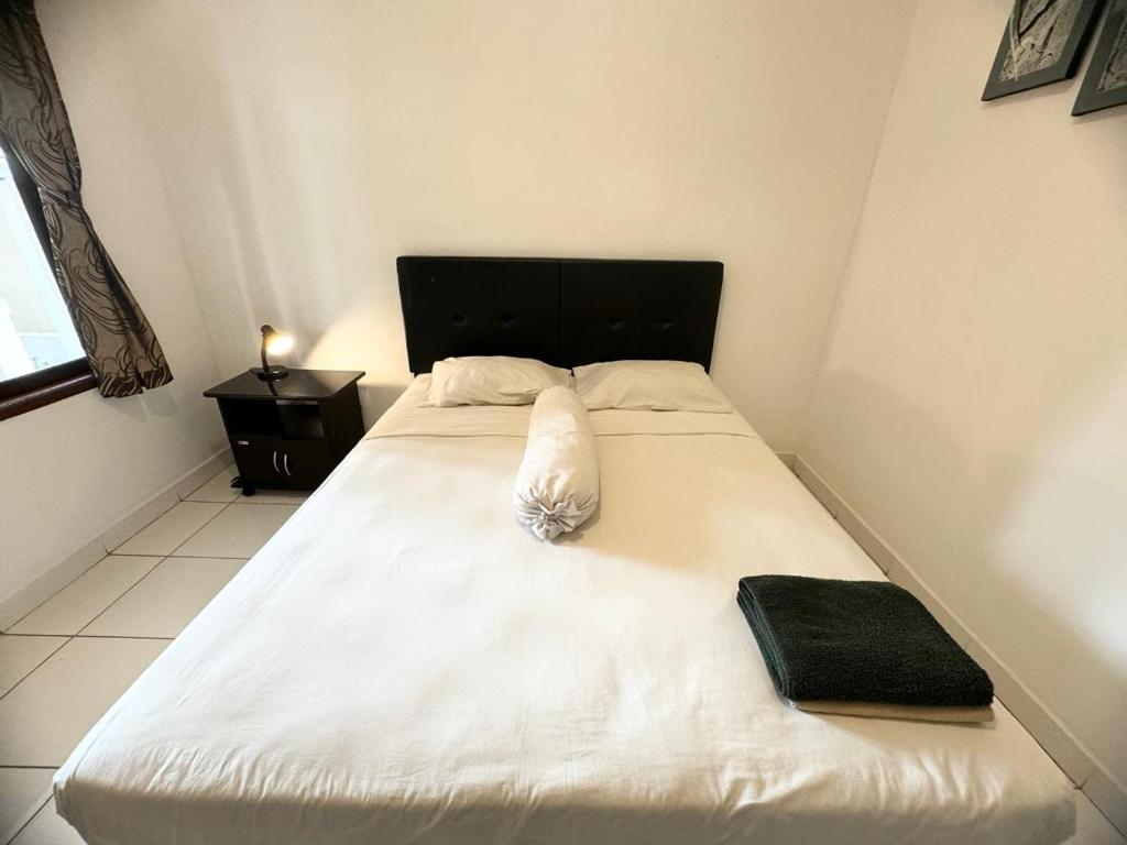Postel nebo postele na pokoji v ubytování Paradise Inn