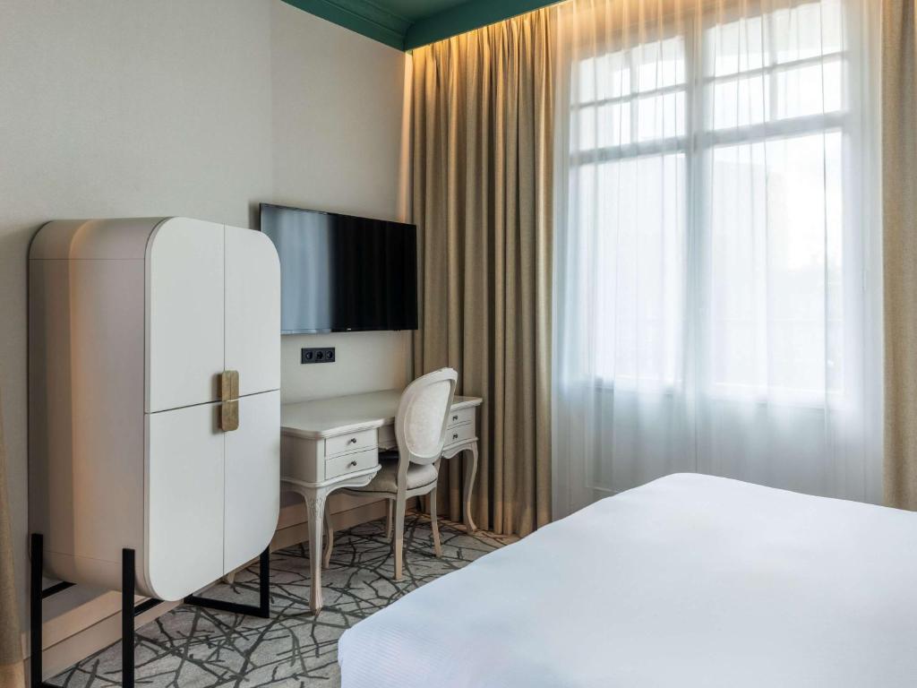 Łóżko lub łóżka w pokoju w obiekcie Rezydent Hotel Sopot - MGallery Collection