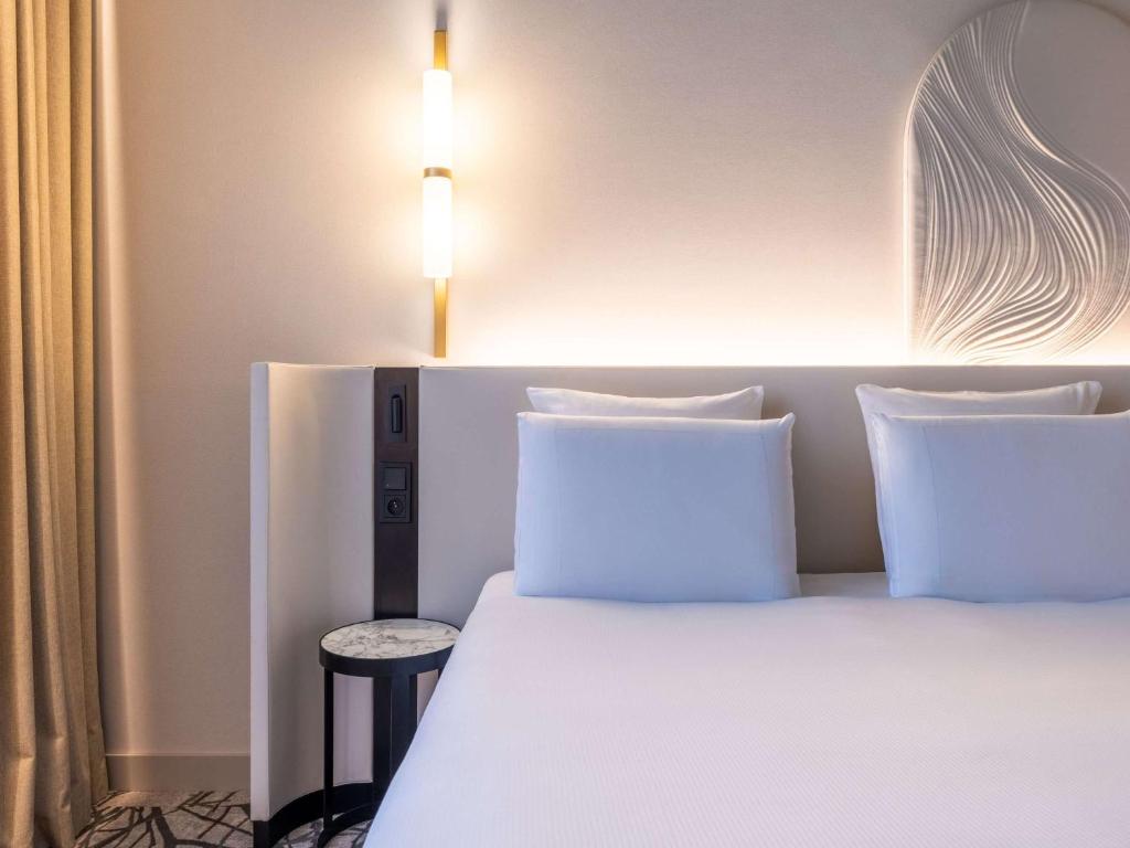Łóżko lub łóżka w pokoju w obiekcie Rezydent Hotel Sopot - MGallery Collection