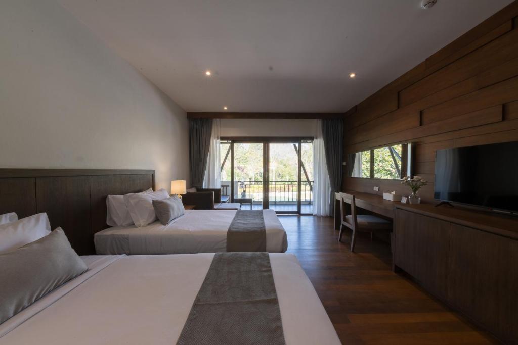 Postel nebo postele na pokoji v ubytování Belle Villa Resort, Khao Yai