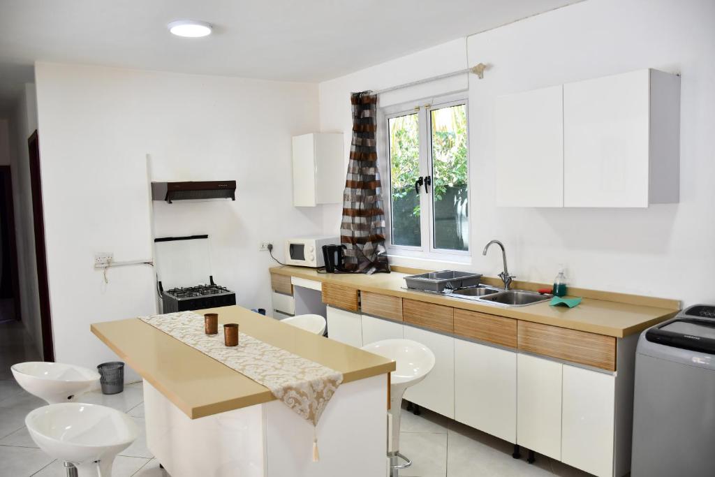 Kuchyň nebo kuchyňský kout v ubytování Martello Apartments