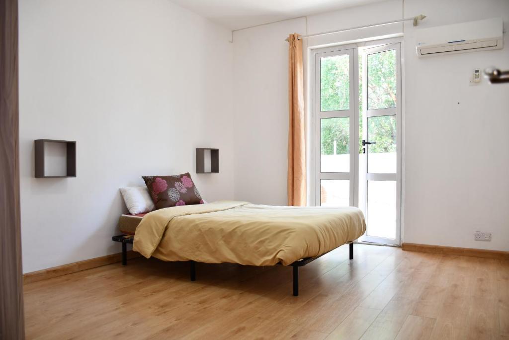 Postel nebo postele na pokoji v ubytování Martello Apartments