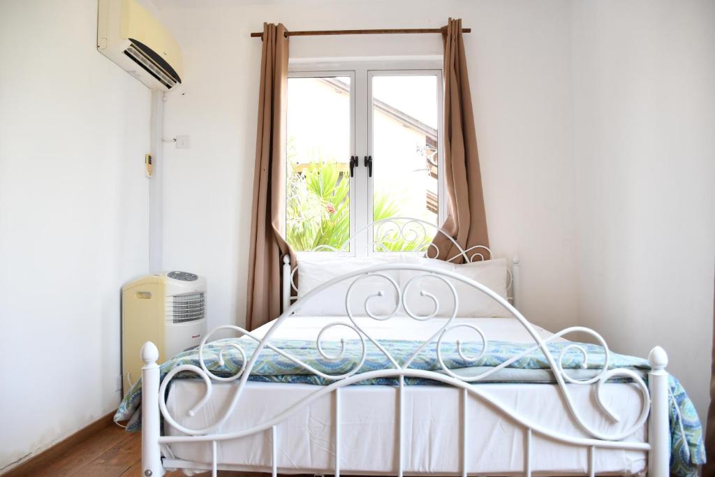 Postel nebo postele na pokoji v ubytování Martello Apartments