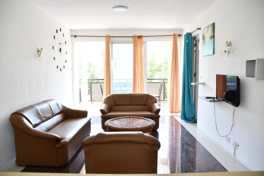 TV a/nebo společenská místnost v ubytování Martello Apartments