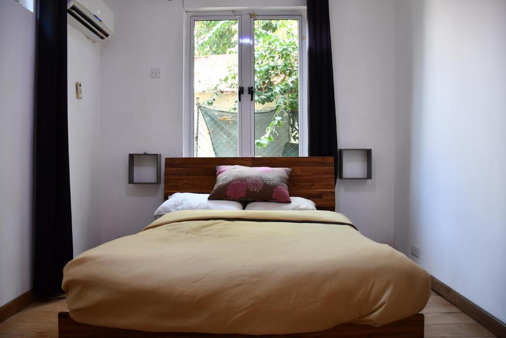 Postel nebo postele na pokoji v ubytování Martello Apartments
