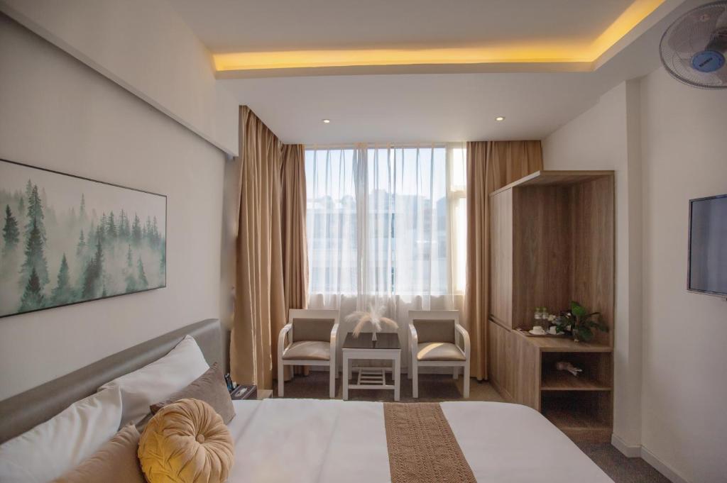 Postel nebo postele na pokoji v ubytování Keypad Hotel - 28 Dịch Vọng Hậu