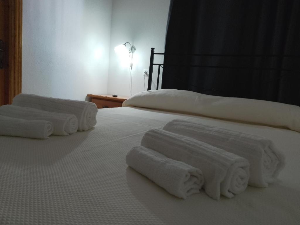 Postel nebo postele na pokoji v ubytování S' Agrùstu