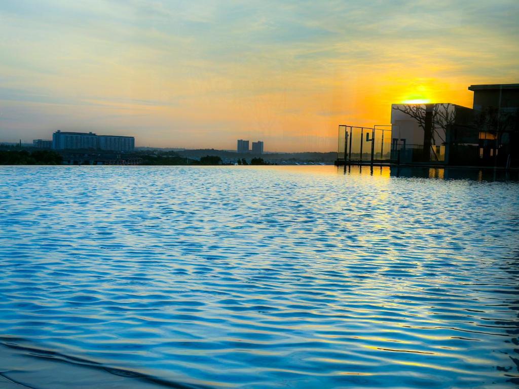 a view of a large body of water at sunset at Kenwingston Cyberjaya Wifi Free Parking in Cyberjaya