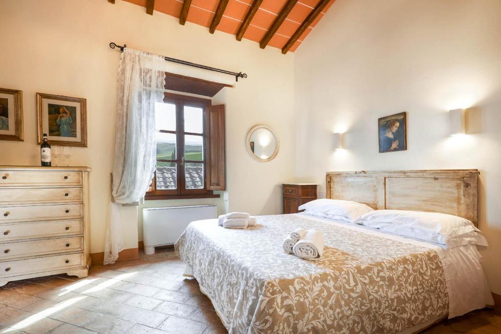 Postel nebo postele na pokoji v ubytování Agriturismo Podere Casato
