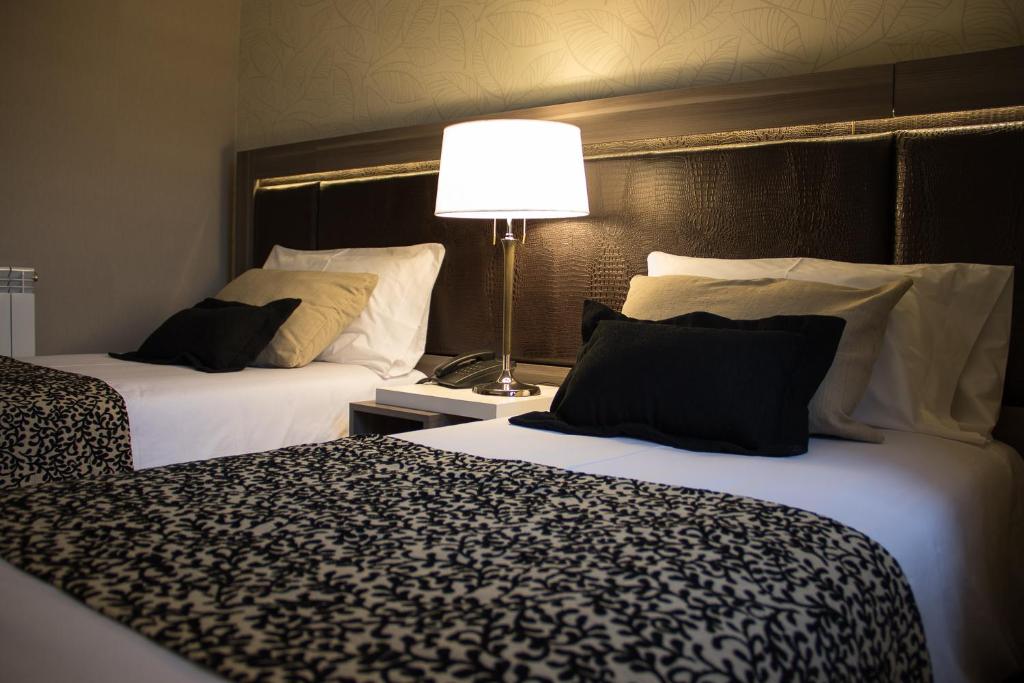 Postel nebo postele na pokoji v ubytování Amerian Río Gallegos Apart & Suites