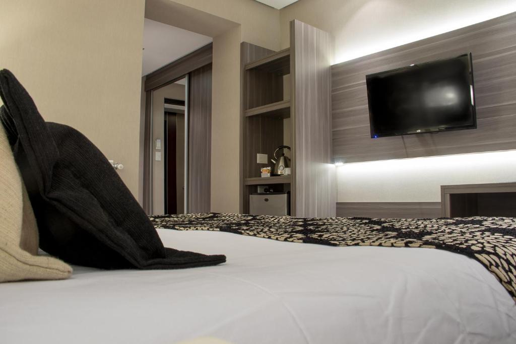 Postel nebo postele na pokoji v ubytování Amerian Río Gallegos Apart & Suites