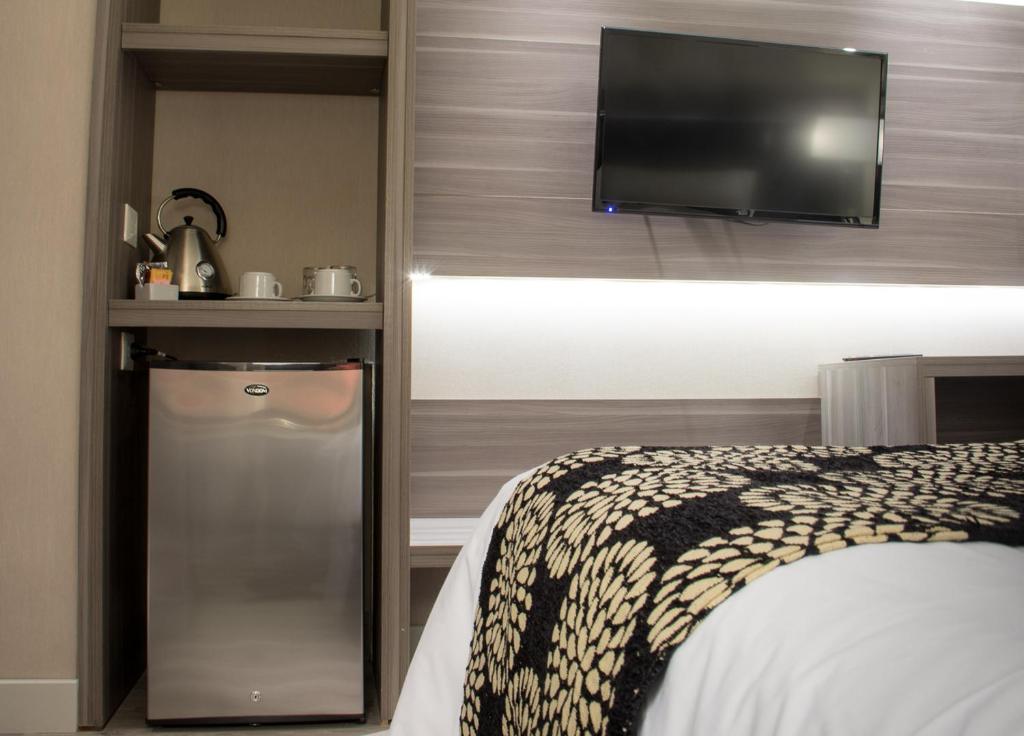 Postel nebo postele na pokoji v ubytování Amerian Río Gallegos Apart & Suites
