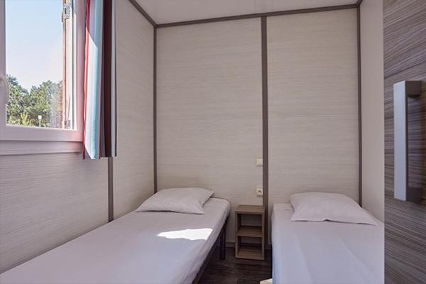 Postel nebo postele na pokoji v ubytování Camping La Presqu'Île du Barcarès