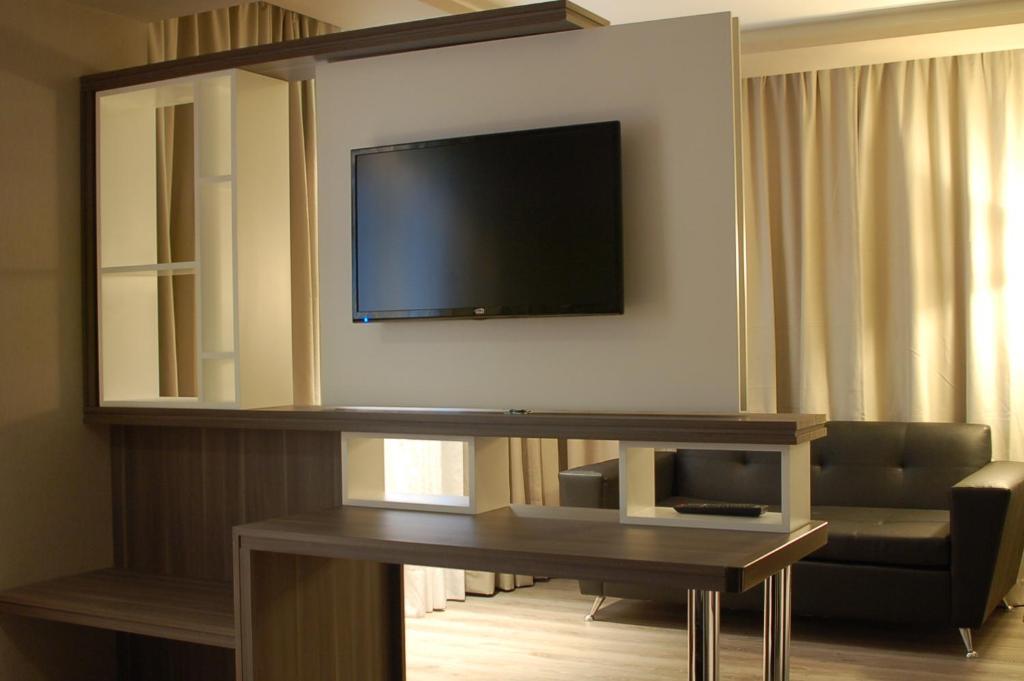 TV a/nebo společenská místnost v ubytování Amerian Río Gallegos Apart & Suites