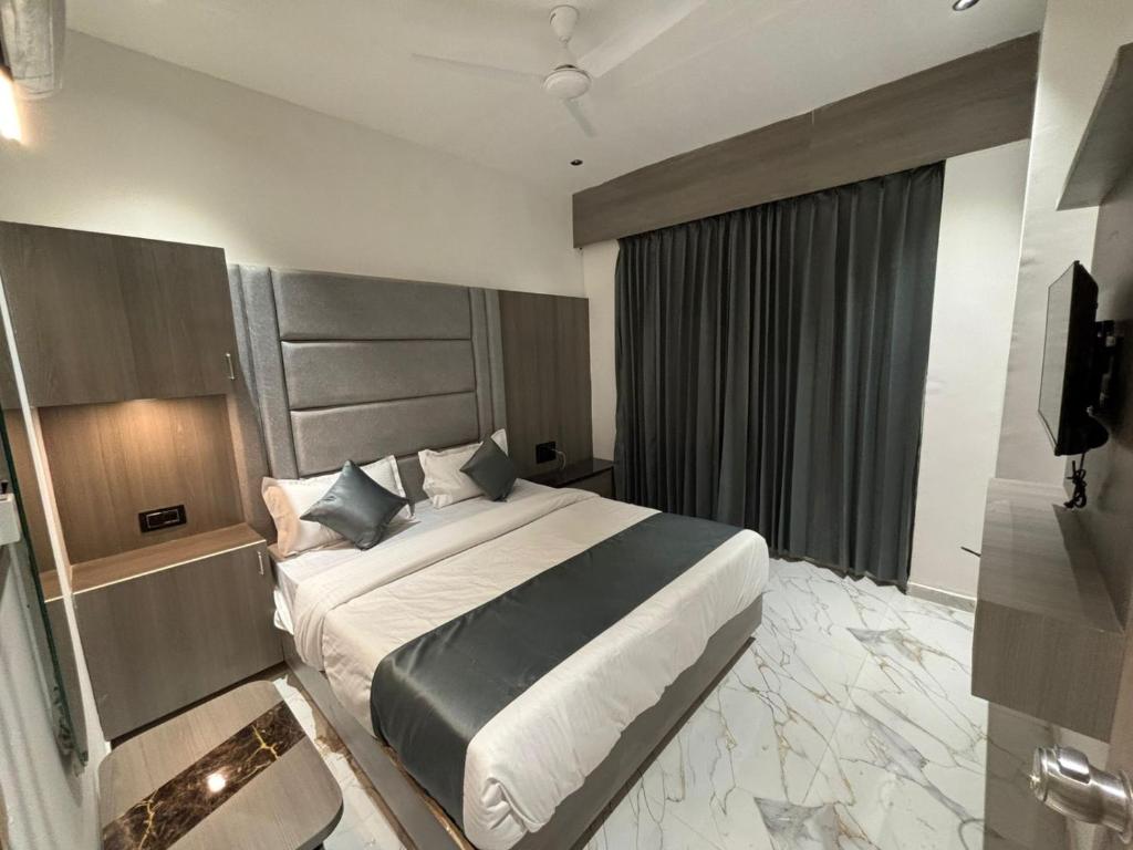 Postel nebo postele na pokoji v ubytování Hotel Pulse Town