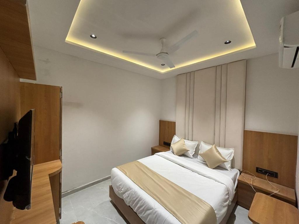 Postel nebo postele na pokoji v ubytování Hotel Pulse Town