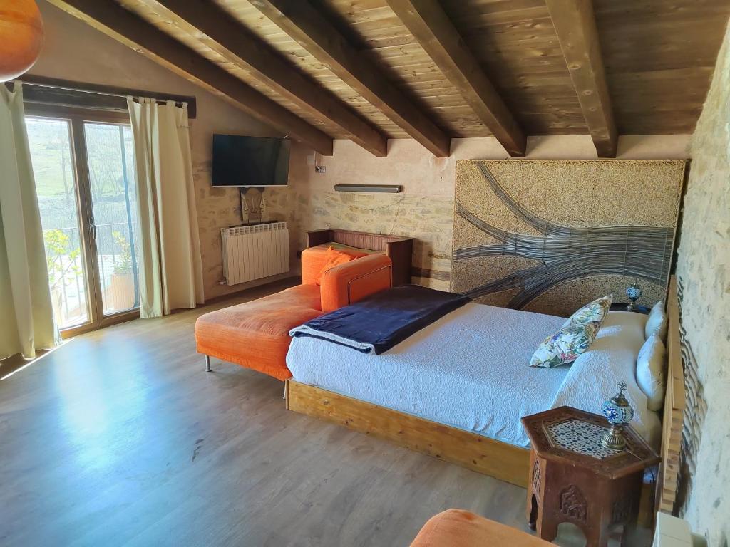 Postel nebo postele na pokoji v ubytování Xana Casa Rural
