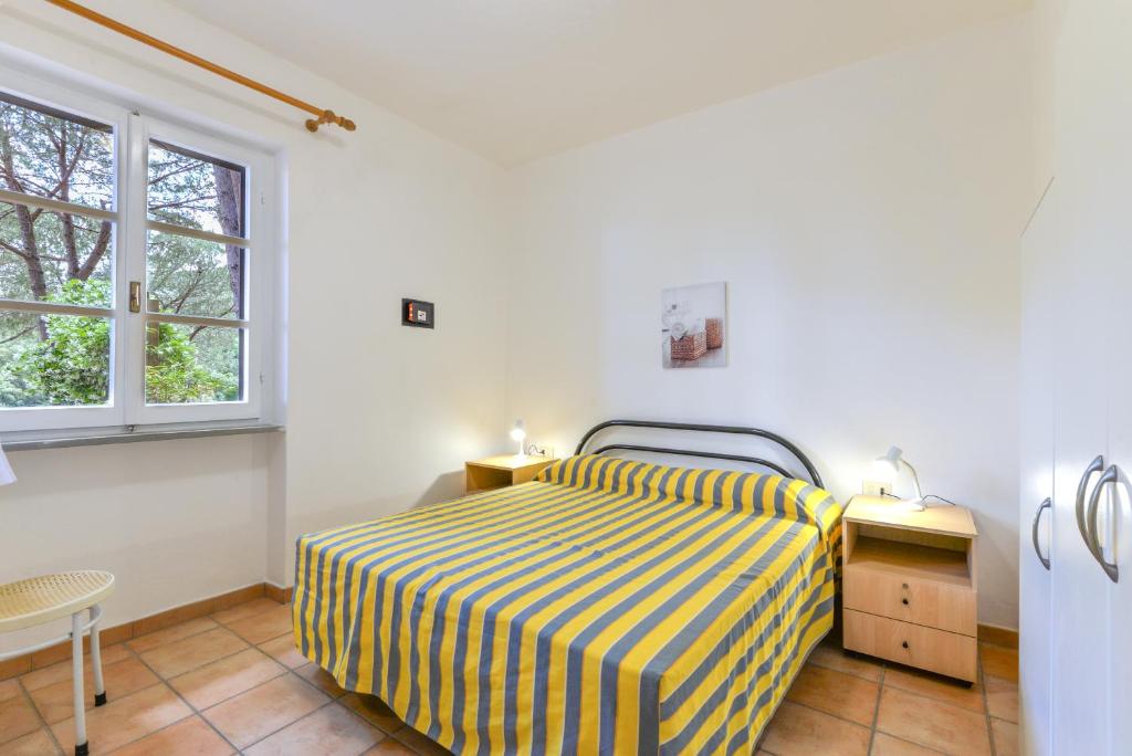 Postel nebo postele na pokoji v ubytování Residence Le Mimose
