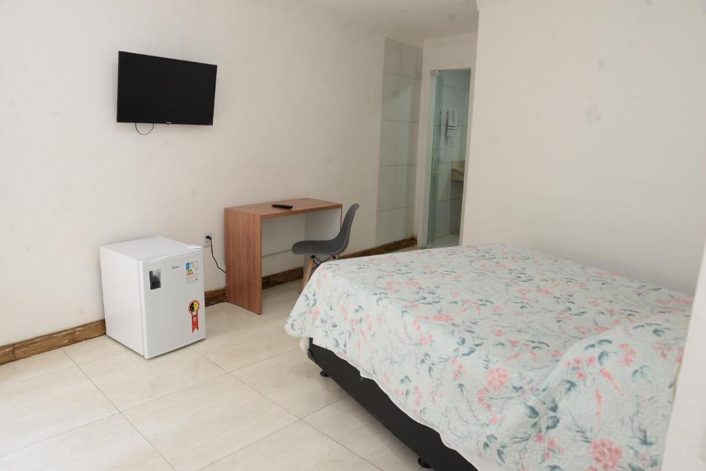 TV a/nebo společenská místnost v ubytování quarto 04