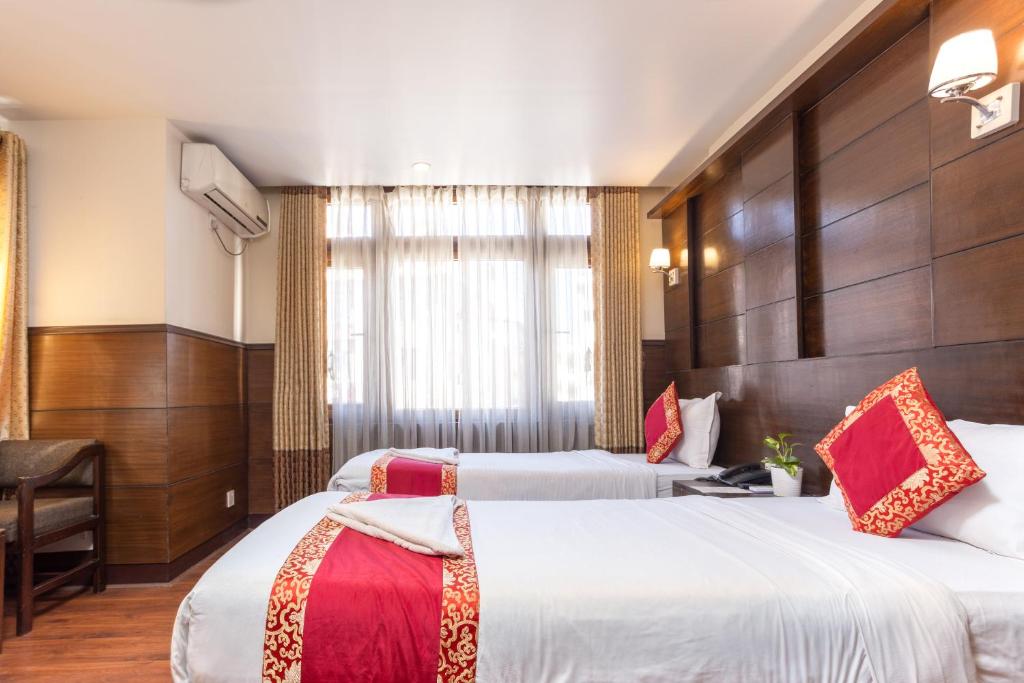 Postel nebo postele na pokoji v ubytování Hotel Buddha