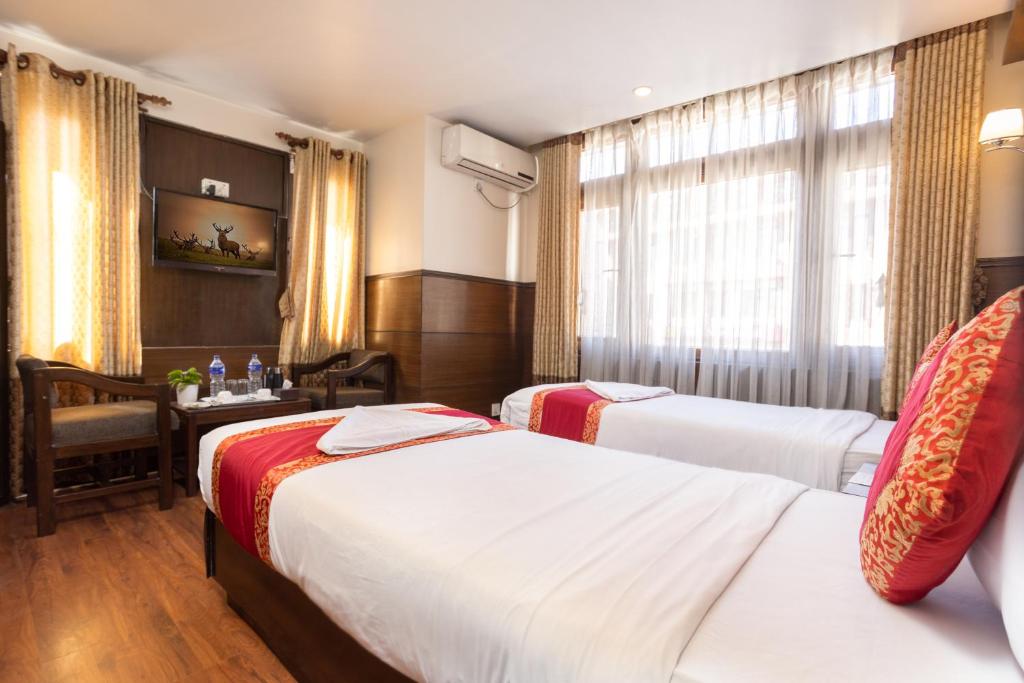 Postel nebo postele na pokoji v ubytování Hotel Buddha