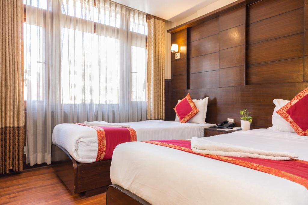 Postel nebo postele na pokoji v ubytování Hotel Buddha
