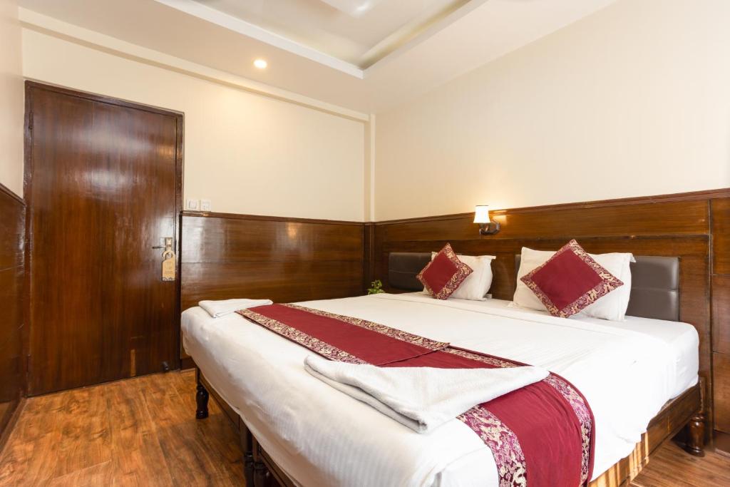 Postel nebo postele na pokoji v ubytování Hotel Buddha