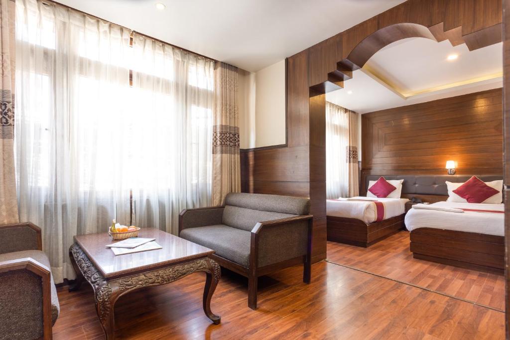 Postel nebo postele na pokoji v ubytování Hotel Buddha