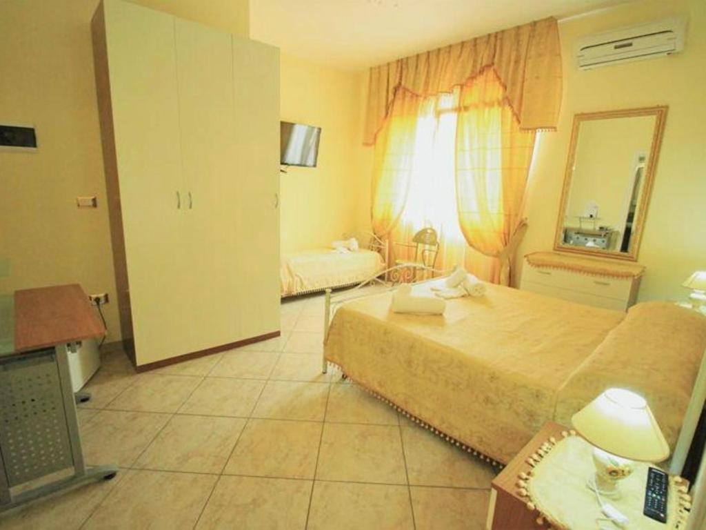 Postel nebo postele na pokoji v ubytování B&B Arcobaleno - Costa